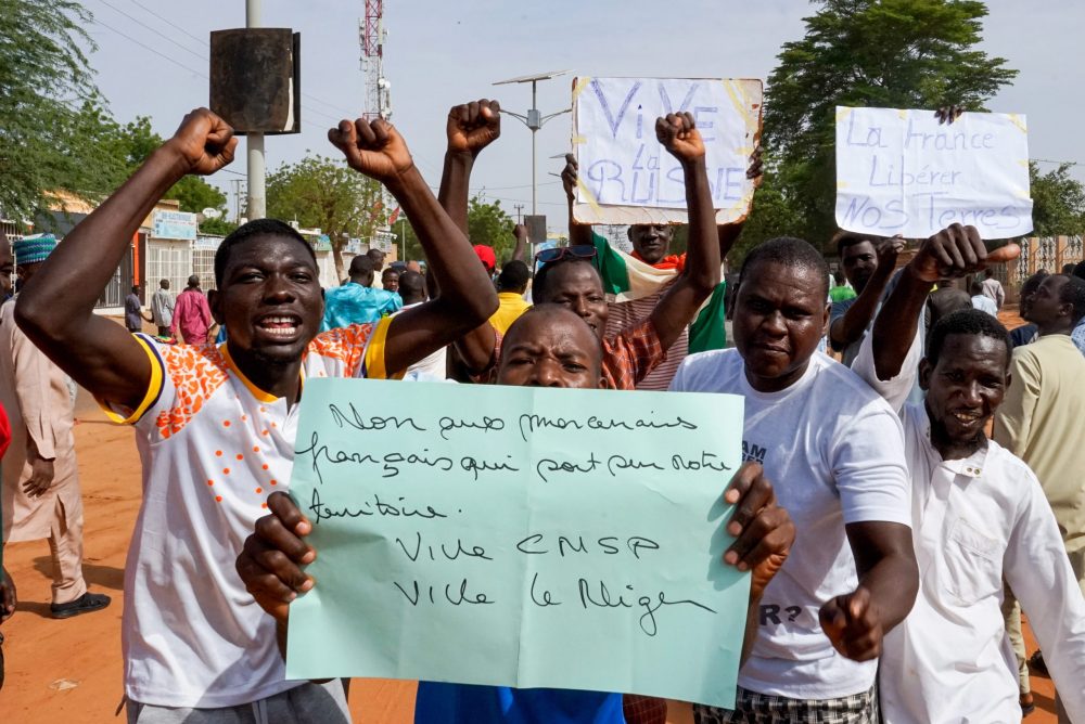 epa10777381 Protesters display a sign that reads ‘No to French mercenaries on our soil, long live CNSP, long live Niger’ during a protest in Niamey, Niger, 30 July 2023. Thousands of supporters of General Abdourahamane Tchiani, head of the Presidential Guard, who declared himself the new leader of Niger after a coup against democratically elected President Mohamed Bazoum on 26 July, took to the streets of Niamey to demonstrate support for the coup.  EPA/ISSIFOU DJIBO
