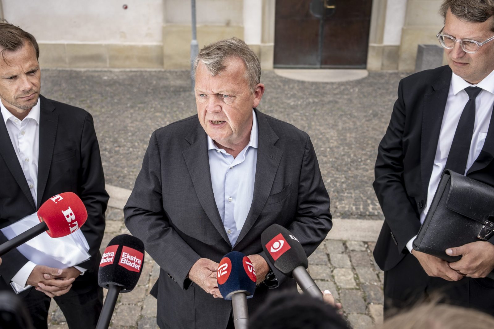 epa10778540 Danish Minister of Foreign Affairs Lars Loekke Rasmussen (C), flanked by Minister of Justice Peter Hummelgaard (L) and acting Minister of Defense Troels Lund Poulsen, speaks to journalists after a briefing by members of the Danish Parliament on the international reactions to the Koran burnings in Copenhagen, Denmark, 31 July 2023.  EPA/Mads Claus Rasmussen  DENMARK OUT