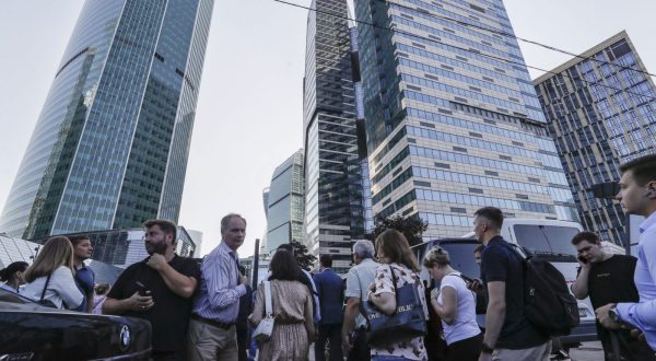 epa10779235 A people walks in near of a damaged building in the Moscow-City business center following a reported drone attack in Moscow, Russia, 01 August 2023. According to Moscow's Mayor Sergei Sobyanin, a drone hit into the same tower building that already was damaged by another drone on 30 July. The facade of the building on the 21st floor was damaged and windows of about 150 square meters were broken. Two drones were destroyed by air defense systems on the territory of the Odintsovo and Naro-Fominsk regions. The Russian Defense Ministry blamed Ukraine for the attack.  EPA/YURI KOCHETKOV