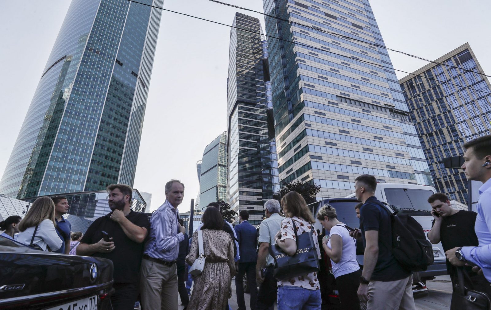 epa10779235 A people walks in near of a damaged building in the Moscow-City business center following a reported drone attack in Moscow, Russia, 01 August 2023. According to Moscow's Mayor Sergei Sobyanin, a drone hit into the same tower building that already was damaged by another drone on 30 July. The facade of the building on the 21st floor was damaged and windows of about 150 square meters were broken. Two drones were destroyed by air defense systems on the territory of the Odintsovo and Naro-Fominsk regions. The Russian Defense Ministry blamed Ukraine for the attack.  EPA/YURI KOCHETKOV
