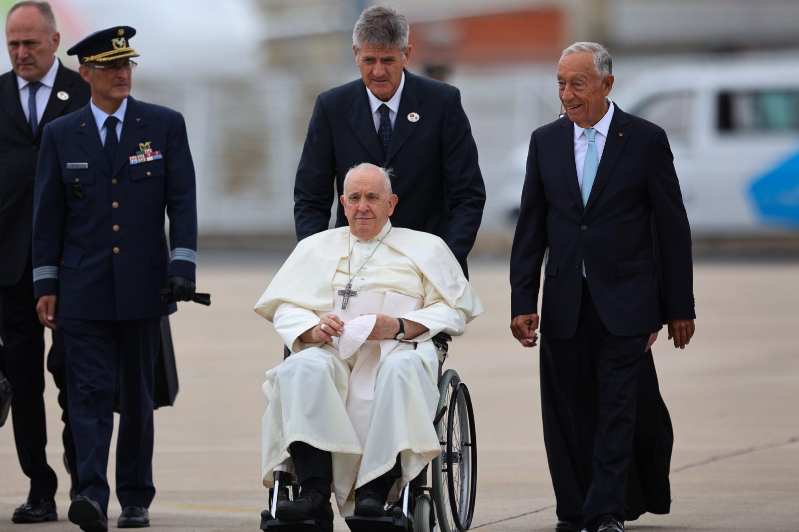 epa10781020 Pope Francis is welcomed by Portugal's President Marcelo Rebelo de Sousa (R) upon his arrival at Figo Maduro airbase in Lisbon, Portugal, 02 August 2023. The Pontiff will be in Portugal on the occasion of World Youth Day (WYD), one of the main events of the Church that gathers the Pope with youngsters from around the world, that takes place until 06 August.  EPA/ANTONIO COTRIM / POOL