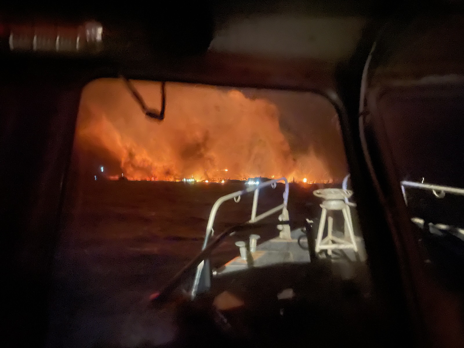epa10795148 A handout photo made available by the United States Coast Guard (USCG) shows USCG crews responding from the ocean to the Lahaina wildfires in Maui, Hawaii, USA, 09 August 2023 (issued 11 August 2023). According to Coast Guard Station Maui, a total of 17 lives were saved from the water and 40 survivors were located ashore by boat crews. At least 53 people were killed in the wildfires buring in Maui, which is considered the largest natural disaster in Hawaii's state history, according to a statement by Hawaii Governor Josh Green. Hundreds of buildings on the island were destroyed and thousands of people were evacuated. On 10 August, US President Biden declared Hawaii wildfires a 'major disaster' and ordered federal aid to supplement state and local recovery efforts in the affected areas.  EPA/PO3 DAVID GRAHAM/US COAST GUARD HANDOUT -- BEST QUALITY AVAILABLE -- HANDOUT EDITORIAL USE ONLY/NO SALES