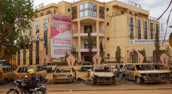 epa10795195 Burnt-out vehicles sit in front of the Nigerien Party for Democracy and Socialism (PNDS-Tarayya), the party of ousted President Mohamed Bazoum, in Niamey, Niger, 11 August 2023. The leaders of the Economic Community of West African States (ECOWAS) have approved the deployment of a 'standby force to restore constitutional order' in Niger, two weeks after democratically elected President Bazoum was ousted in a coup lead by General Abdourahmane Tchiani, head of the presidential guard.  EPA/ISSIFOU DJIBO