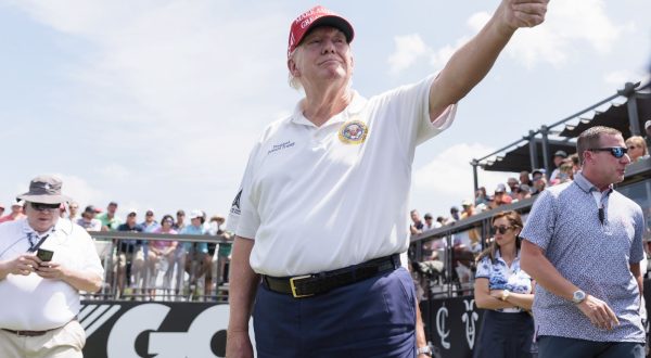 epa10795749 Former US President Donald J. Trump on the first tee at the start of the first round of the LIV Golf tournament at Trump National Golf Club Bedminster in Bedminster, New Jersey, USA, 11 August 2023.  EPA/JUSTIN LANE