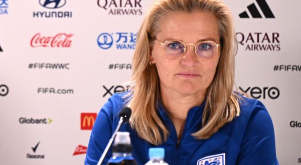 epa10801057 England head coach Sarina Wiegman (R) and captain Millie Bright speak to media during a team England press conference at Stadium Australia in Sydney, Australia, 15 August 2023.  EPA/DAN HIMBRECHTS AUSTRALIA AND NEW ZEALAND OUT