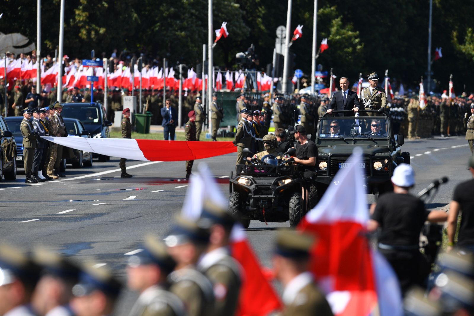 epa10801372 Polish President Andrzej Duda (2R) and Polish Chief of General Staff Gen. Rajmund Andrzejczak (R) take part in the military parade during the Polish Armed Forces Day in Warsaw, Poland, 15 August 2023.  Polish Armed Forces Day is a national holiday celebrated annually on 15 August in Poland, commemorating the anniversary of the 1920 victory over Soviet Russia at the Battle of Warsaw during the Polish-Soviet War.  EPA/Radek Pietruszka POLAND OUT
