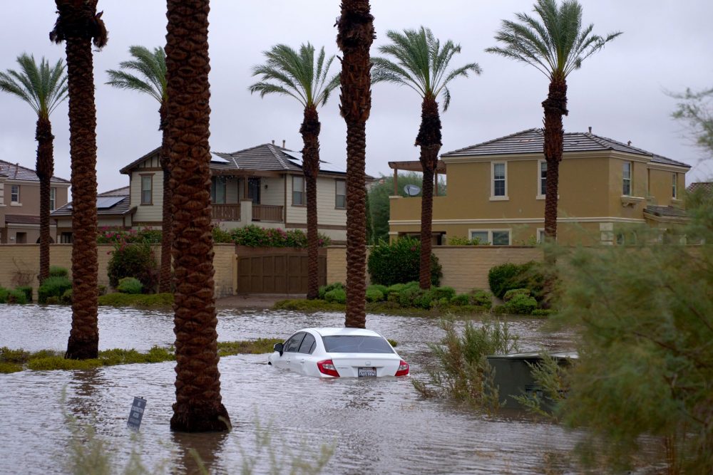 epa10811212 A car is submerged in flooded water as Tropical Storm Hilary arrives in Cathedral City, California, USA, 20 August 2023. Southern California is under a tropical storm warning for the first time in history as Hilary makes landfall. The last time a tropical storm made landfall in Southern California was 15 September 1939, according to the National Weather Service.  EPA/ALLISON DINNER