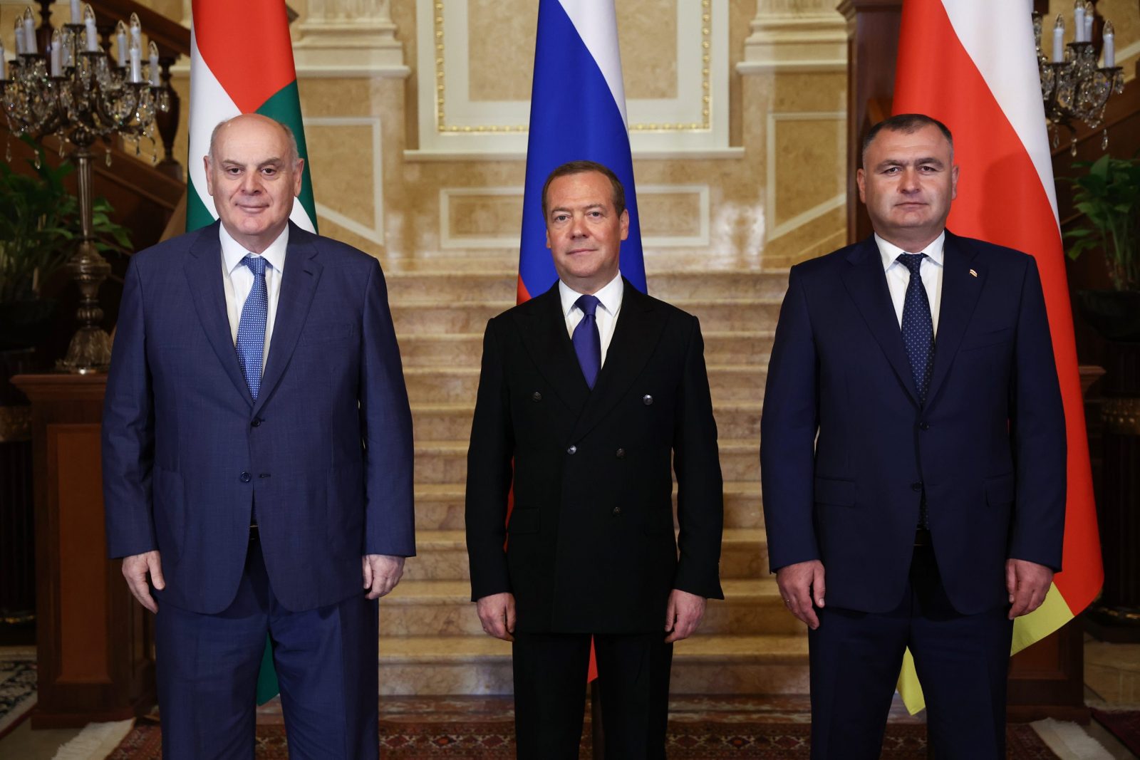epa10819776 Deputy head of Russia's Security Council and chairman of the United Russia party, Dmitry Medvedev (C) poses for a picture during his meeting with President of the Republic of Abkhazia Aslan Bzhania (L) and President of the Republic of South Ossetia Alan Gagloev (R) in Moscow, Russia, 25 August 2023.  EPA/VALERY SHARIFULIN / SPUTNIK / GOVERNMENT PRESS SERVICE POOL