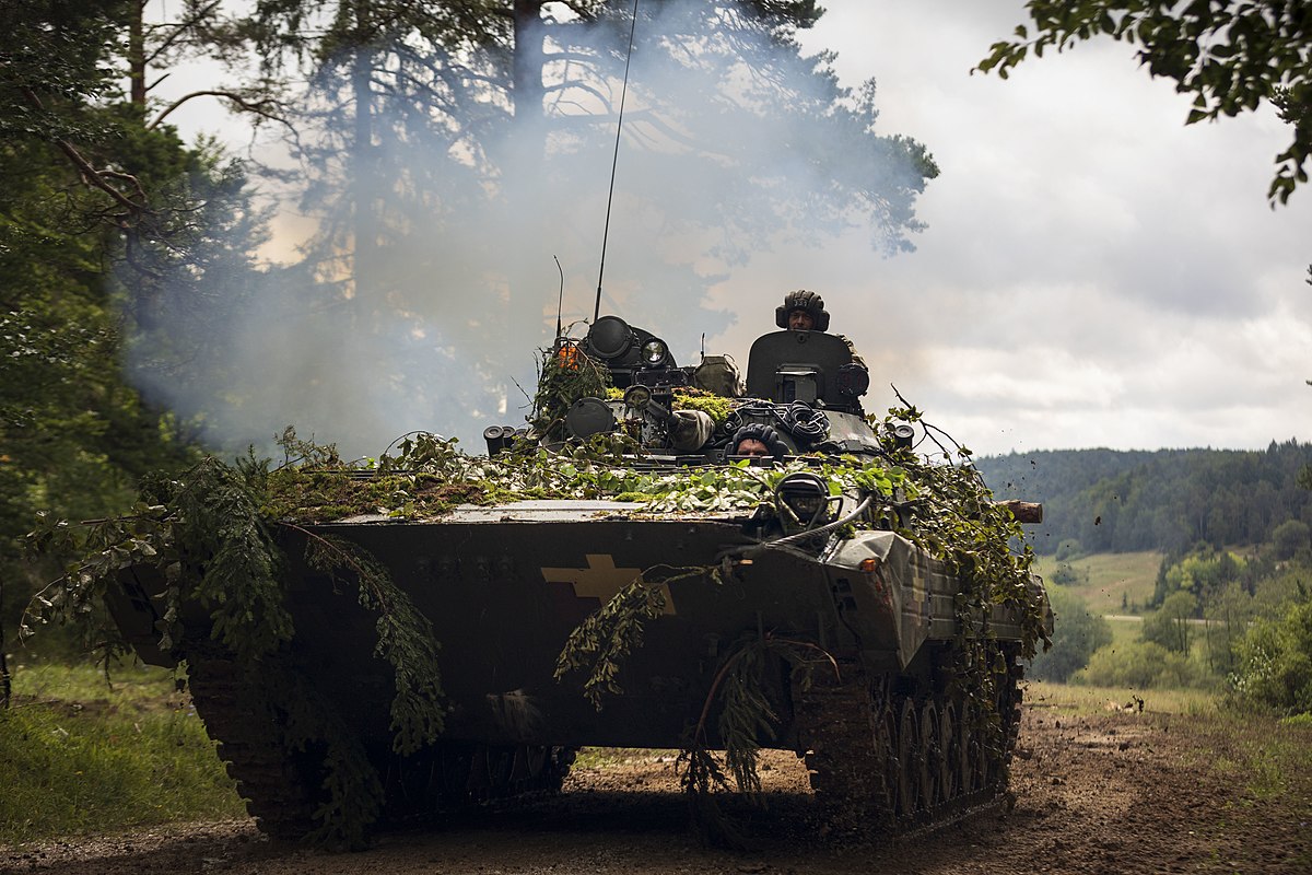 Ukrainian soldiers roll out in a BMP-1 amphibious tracked infantry fighting vehicle, to defend against Opposing Forces (OPFOR) during a simulated battle in “the box” during the culminating force on force exercise of Combined Resolve XII at the Joint Multinational Readiness Center in Hohenfels, Germany Aug. 19, 2019. Combined Resolve is a biannual U.S. Army Europe and 7th Army Training Command-led exercise intended to evaluate and certify the readiness and interoperability of US forces mobilized to Europe in support of Atlantic Resolve.  (U.S. Army photo by Sgt. Thomas Mort)