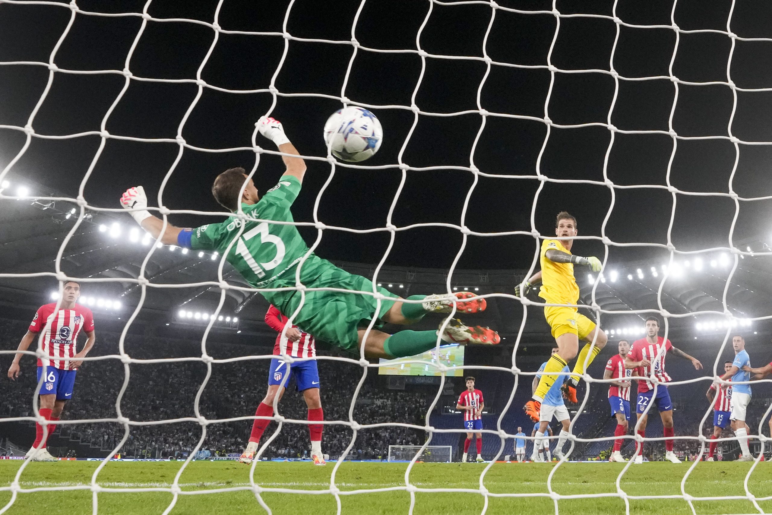 Lazio's goalkeeper Ivan Provedel, right, scores his side's opening goal during a Champions League group E soccer match between Lazio and Atletico Madrid, at Rome's Olympic Stadium, Tuesday, Sept. 19, 2023. (AP Photo/Andrew Medichini)