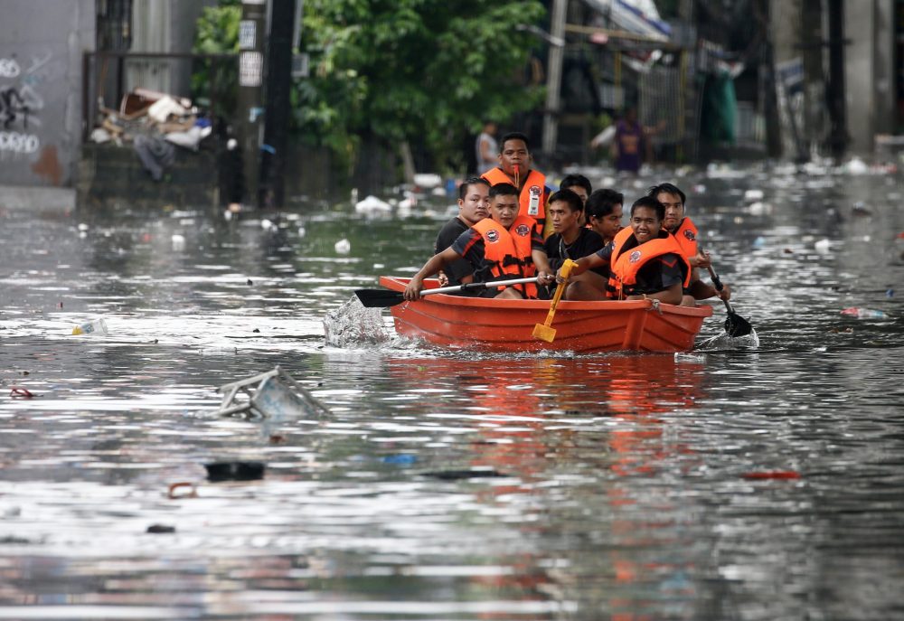 epa10830344 An emergency response team uses a raft to help transport residents along a flooded road in Quezon City, Metro Manila, Philippines, 31 August 2023. Typhoon Saola, which has left the Philippine Area of Responsibility, and Tropical Storm Haikui off the coast of extreme northern provinces are enhancing a southwest monsoon bringing rains in the western Luzon region of the country, according to data from the Philippine Atmospheric Geophysical and Astronomical Services Administration (PAGASA). Figures from the National Disaster Risk Reduction and Management Council (NDRRMC) show that over 305,000 individuals were affected by the passing of Typhoon Saola.  EPA/ROLEX DELA PENA