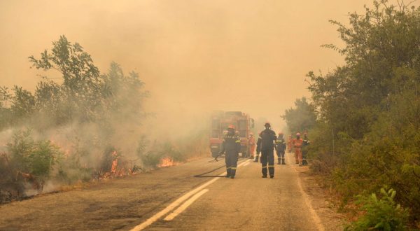 epa10830804 Firefighters operate during a wildfire in the area of Giannouli, Evros region, northern Greece, 31 August 2023. The Fire Brigade continues to battle fires in the wider area of Evros. Local authorities on 31 August ordered residents of Giannouli and Sidiro to evacuate due to flare-ups in the wider area. Assistance is provided by the European Civil Protection Mechanism with forces from France, Germany, Spain, Cyprus, Romania, Czech Republic, Bulgaria, Slovakia, Albania and Serbia.  EPA/DIMITRIS ALEXOUDIS