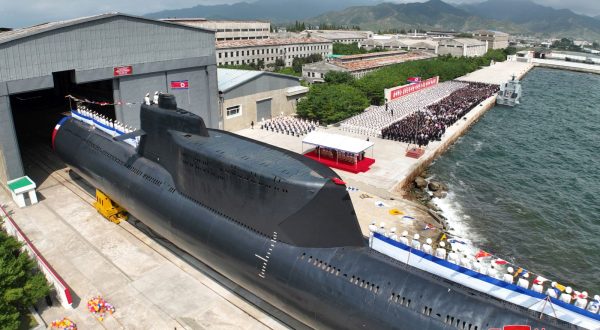 epa10847725 A photo released by the official North Korean Central News Agency (KCNA) shows a launching ceremony for what is said to be a tactical nuclear-armed submarine, designated No. 841 or Hero Kim Kun Ok, at the Sinpho shipyard in North Korea, 06 September 2023 (issued 08 September 2023).  EPA/KCNA   EDITORIAL USE ONLY
