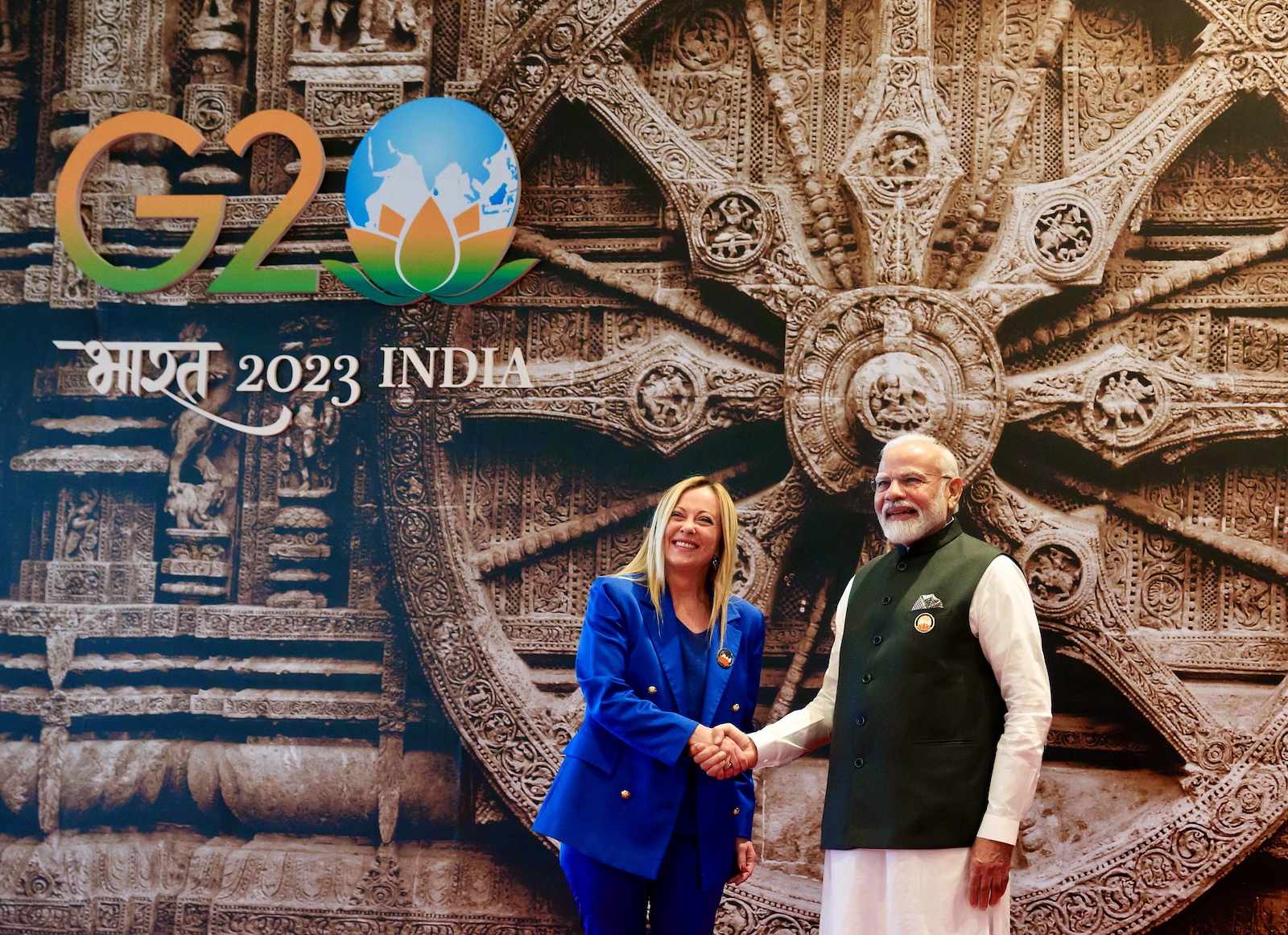 epa10849960 A handout picture made available by the Chigi Palace (Palazzo Chigi) Press Office shows the Prime Minister of Italy, Giorgia Meloni, Giorgia Meloni (L) being welcomed by Indian Prime Minister Narendra Modi (R) as she arrives for the first session of the G20 Summit at the ITPO Convention Centre Pragati Maidan in New Delhi, India, 09 September 2023. The G20 Heads of State and Government summit takes place in the Indian capital on 09 and 10 September.  EPA/FILIPPO ATTILI / HANDOUT  HANDOUT EDITORIAL USE ONLY/NO SALES
