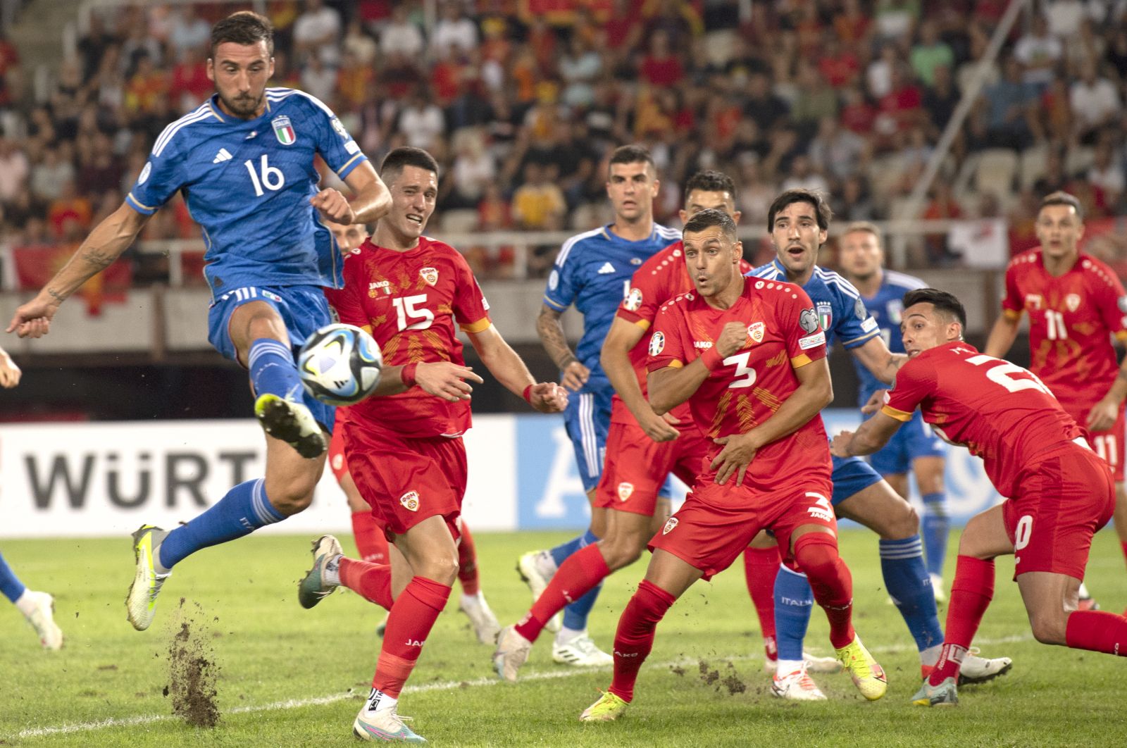 epa10851258 Bryan Cristiante (L) of Italy in action against Jovan Manev (2-L) of North Macedonia during the UEFA Euro 2024 qualifying soccer match between North Macedonia and Italy in Skopje, North Macedonia, 09 September 2023.  EPA/GEORGI LICOVSKI