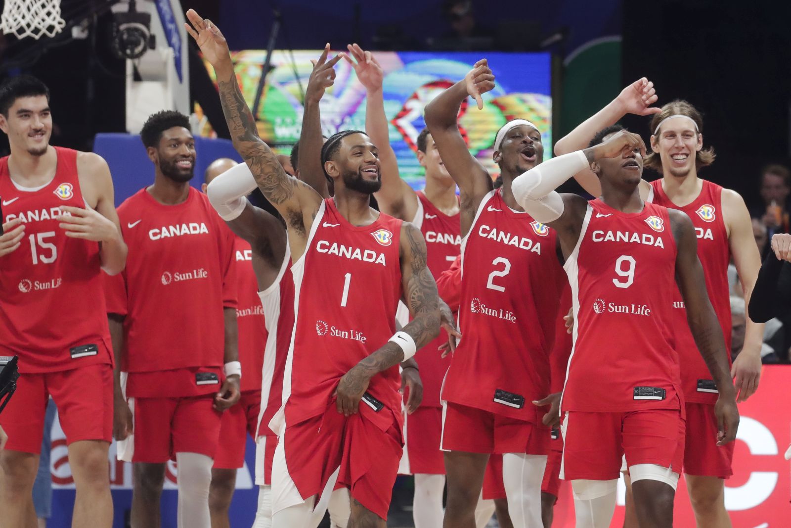epa10852286 Canada players celebrate after winning the FIBA Basketball World Cup 2023 third place match between Canada and the USA at the Mall of Asia in Manila, Philippines, 10 September 2023.  EPA/FRANCIS R. MALASIG