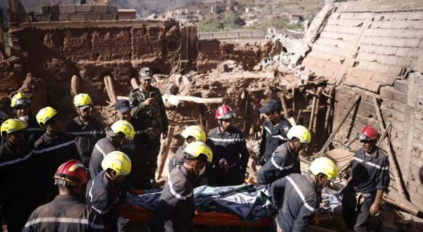 epa10852989 Rescue workers recover a victim's body during a rescue operation following a powerful earthquake in Ouirgane, south of Marrakesh, Morocco, 10 September 2023. A magnitude 6.8 earthquake that struck central Morocco late 08 September has killed at least 2,012 people and injured 2,059 others, 1,404 of whom are in serious condition, damaging buildings from villages and towns in the Atlas Mountains to Marrakesh, according to a report released by the country's Interior Ministry. The earthquake has affected more than 300,000 people in Marrakesh and its outskirts, the UN Office for the Coordination of Humanitarian Affairs (OCHA) said. Morocco's King Mohammed VI on 09 September declared a three-day national mourning for the victims of the earthquake.  EPA/YOAN VALAT
