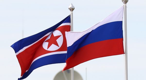 epa10859178 Flags of North Korea (L) and Russia fly during a visit of Russian President Putin and North Korean leader Kim Jong Un to the Vostochny cosmodrome, outside the town of Tsiolkovsky (former Uglegorsk), some 180km north of Blagoveschensk in Amur region, Russia, 13 September 2023.  EPA/ARTEM GEODAKYAN/SPUTNIK/KREMLIN / POOL MANDATORY CREDIT