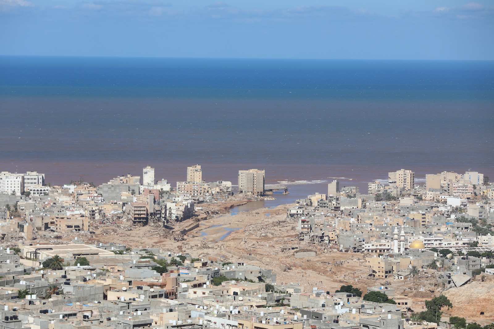 epa10859582 A general view of Derna, Eastern Libya, 13 September 2023, days after Storm Daniel brought heavy rains to the area resulting in the collapse of two dams and a flash flood which especially devastated the town of Derna. The Libyan Red Cresent reported that the floods caused by storm Daniel on 10 September in eastern Libya left thousands of people dead and according to preliminary statistics, the number of missing people has exceeded ten thousand people.  EPA/Mohamed Shalash