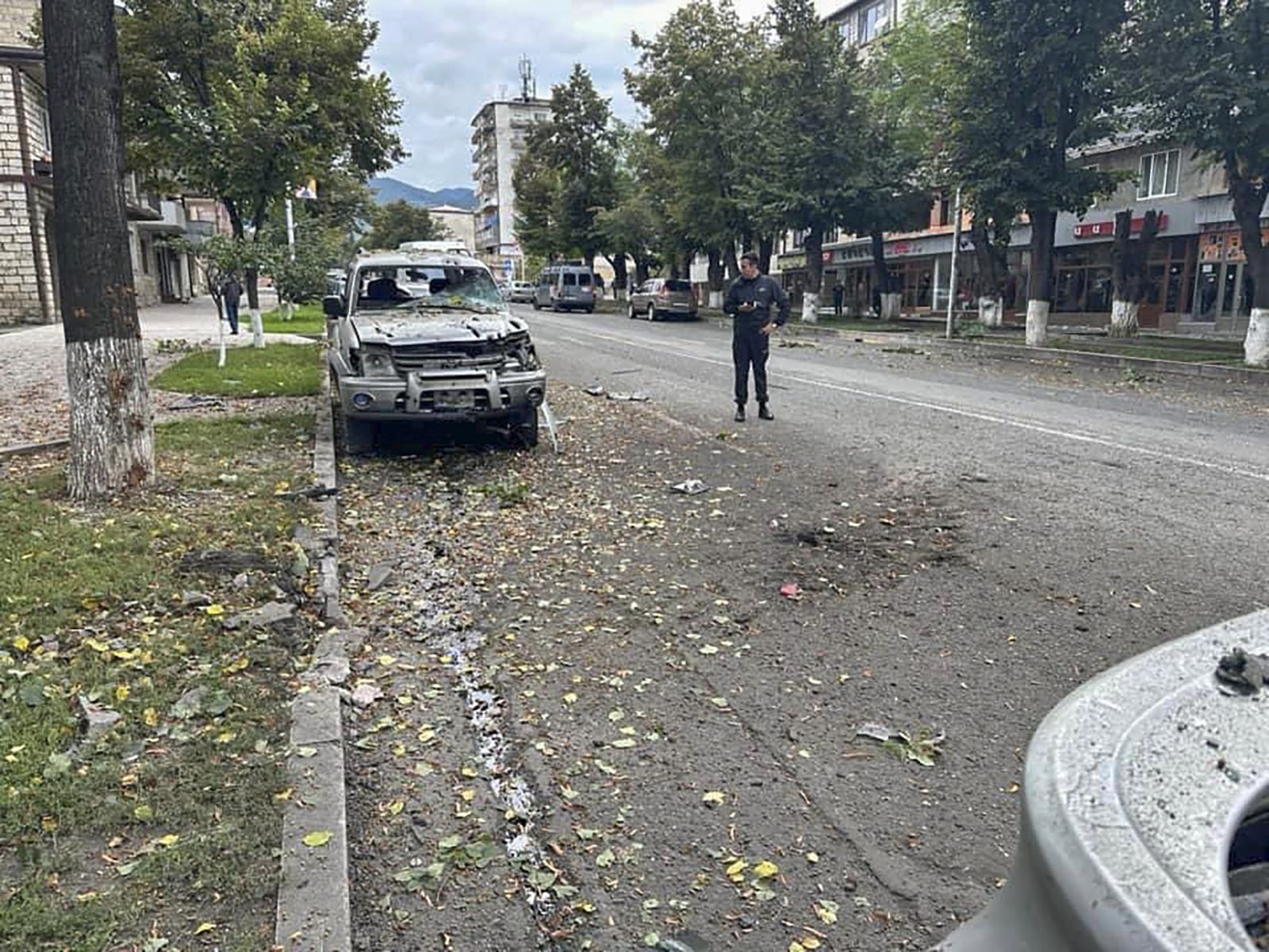 epa10871536 A handout photo made available by Artsakh / Nagorno-Karabakh Human Rights Ombudsman shows a damaged vehicle following the Azeri military operation in Stepanakert, Nagorno-Karabakh, 20 September 2023. More than two thousand civilians, including 1,049 children, were evacuated from the 'most dangerous areas' of Nagorno-Karabakh, the Russian ministry said. Azerbaijan's Ministry of Defense announced on 20 September that it agreed to a proposal for a ceasefire with ethnic Armenians in Azerbaijan's breakaway region of Nagorno-Karabakh, a day after Azerbaijan began an offensive to take control of the enclave.  EPA/ARTSAKH / NAGORNO-KARABAKH HUMAN RIGHTS OMBUDSMAN/HANDOUT -- MANDATORY CREDIT -- BEST QUALITY AVAILABLE --   HANDOUT EDITORIAL USE ONLY/NO SALES HANDOUT EDITORIAL USE ONLY/NO SALES