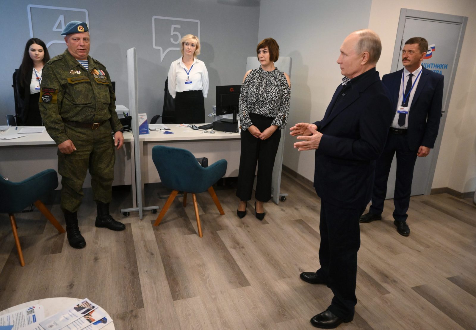 epa10875104 Russian President Vladimir Putin (R) speaks as he visits the Vozvrashchenie (Return) Center, a support center for participants of the special military operation and their families, in Veliky Novgorod, Russia, 21 September 2023. Russian President arrived in Veliky Novgorod to hold a meeting of the State Council dedicated to the development of the labor market. The Return Center, which was opened on 01 June 2023, provides assistance to SVO (Special military operation) participants, veterans and disabled combat veterans and members of their families, family members of deceased participants and combat veterans.  EPA/ILYA PITALEV/SPUTNIK/KREMLIN POOL / POOL MANDATORY CREDIT