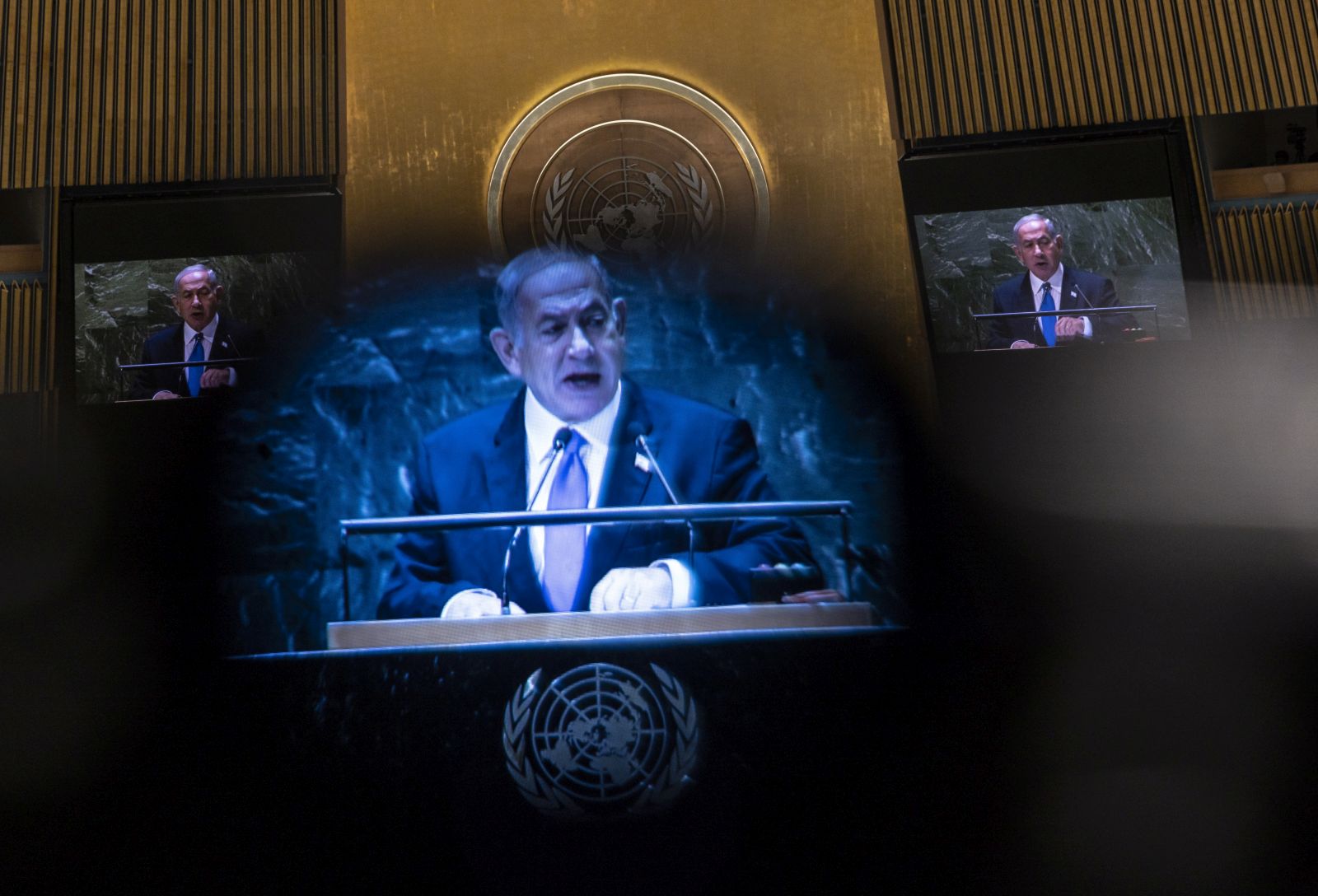 epa10876742 Israel's Prime Minister Benjamin Netanyahu is seen through a camera's viewfinder as he addresses the delegates during the 78th session of the United Nations General Assembly at the United Nations Headquarters in New York, New York, USA, 22 September 2023.  EPA/JUSTIN LANE