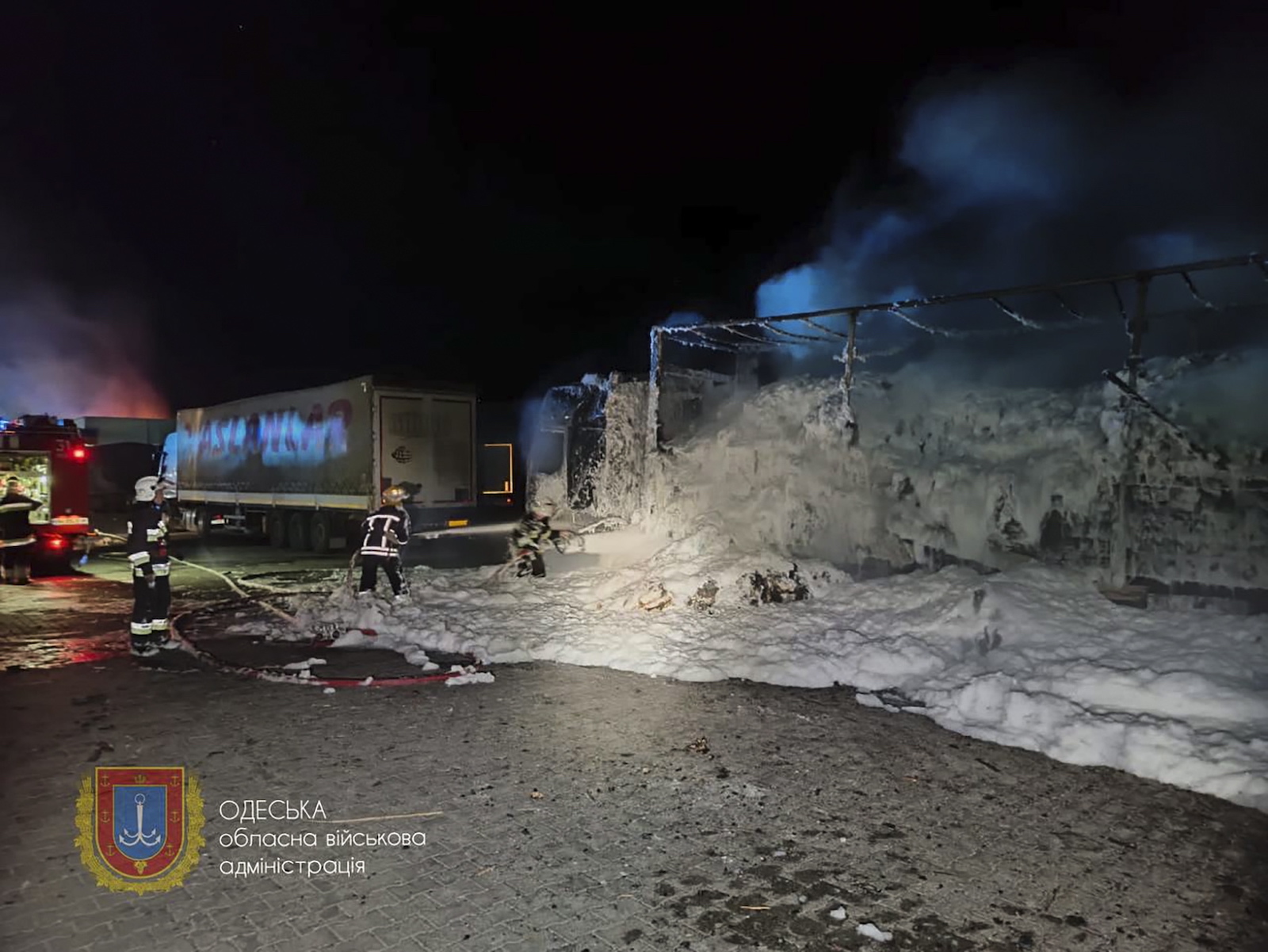 epa10883297 A handout photo made available by the Odesa Regional State Administration shows rescuers working to put down a fire after an overnight attack of a seaport infrastructure object in the Odesa region, southern Ukraine, 26 September 2023. At least two people were injured in the attack according to Oleg Kiper, the Head of Odesa Regional State Administration. Russian troops entered Ukrainian territory in February 2022, starting a conflict that has provoked destruction and a humanitarian crisis.  EPA/ODESA REGIONAL STATE ADMINISTRATION / HANDOUT HANDOUT  HANDOUT EDITORIAL USE ONLY/NO SALES