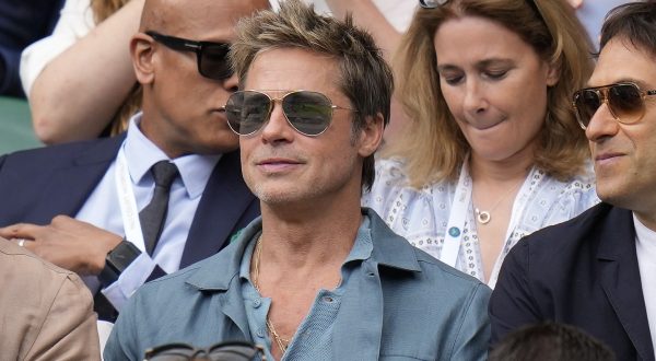 Actor Brad Pitt sits in the stands on Centre Court for the final of the men's singles between Spain's Carlos Alcaraz and Serbia's Novak Djokovic on day fourteen of the Wimbledon tennis championships in London, Sunday, July 16, 2023. (AP Photo/Kirsty Wigglesworth)
