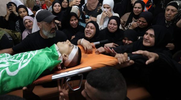 epa10871219 Relatives of  Al Qassam brigades militant Mahmoud Al Sadi mourn him during his funeral at Jenin refugee camp, West Bank, 20 September 2023. According to the Palestinian Health Ministry, at least six Palestinians were killed during overnight Israeli military operations in the West Bank and a separate incident during unrest in the Gaza Strip on September 20. According to Palestinian officials, four people were killed in Jenin, one in Jericho, and one in Gaza.  EPA/ALAA BADARNEH 28780