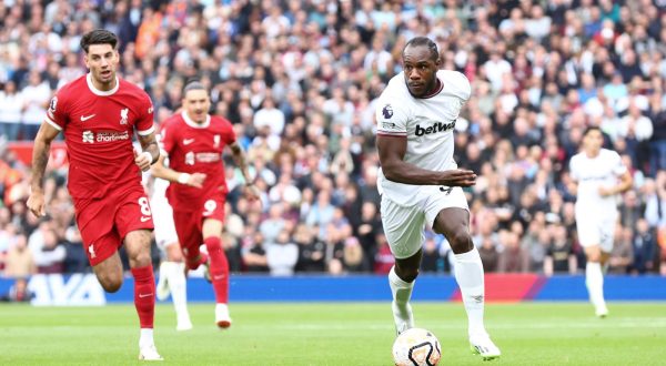 epa10880920 Michail Antonio of West Ham United in action against Dominik Szoboszlai of Liverpool during the English Premier League soccer match between Liverpool FC and West Ham United in Liverpool, Britain, 24 September 2023.  EPA/ADAM VAUGHAN EDITORIAL USE ONLY. No use with unauthorized audio, video, data, fixture lists, club/league logos or 'live' services. Online in-match use limited to 120 images, no video emulation. No use in betting, games or single club/league/player publications.