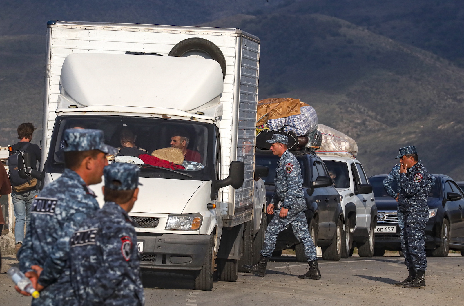 epa10887801 Armenian police organise passing of ethnic Armenians fleeing Nagorno-Karabakh region after they crossed the Azerbaijan-Armenia border near the village of Kornidzor, Armenia, 28 September 2023. Azerbaijan on 19 September 2023 launched a brief military offensive on the contested region of Nagorno-Karabakh, a breakaway enclave that is home to some 120,000 ethnic Armenians. The Armenian government announced the evacuation of more than 68,000 local residents from Nagorno-Karabakh, following a ceasefire agreed on 20 September with Azerbaijan. Nagorno-Karabakh will cease to exist as a self-proclaimed state from 01 January 2024, the regionâ€™s separatist leader, Samvel Shakhramanyan, announced on 28 September, after signing a decree to dissolve all its institutions.  EPA/ANATOLY MALTSEV
