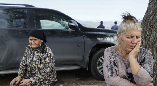 epa10893774 (FILE) -Ethnic Armenians fleeing Nagorno-Karabakh region rest on a roadside after crossing the border with Azerbaijan, near the village of Kornidzor, Armenia, 28 September 2023.(Issued 01 October 2023). The self-declared Republic of Nagorno-Karabakh, is a territory mostly home to ethnic Armenians that the Soviets allocated to Azerbaijan in 1921 and is recognized as Azerbaijani by the international community.  Some 120,000 ethnic Armenians of the enclave have, in September 2023, joined again the roads to exodus. Caught in the conflict  with Azerbaijan,  and after dozens of violence flares since the 1990's, they have repeatedly had to leave their lands and become displaced or refugees in the tens of thousands, losing over the years their homes and thousands of loved ones to direct fighting or to collateral damage.  After a ceasefire was agreed on, on 20 September 2023, Azerbaijan opened all the checkpoints with Armenia for the unimpeded exit of civilians from the disputed territory. The Armenian government announced the evacuation of more than 96,000 local residents from Nagorno-Karabakh, and a humanitarian center has been set up near the main route between Armenia and the breakaway region. Nagorno-Karabakh will cease to exist as a self-proclaimed state from 01 January 2024, the region's separatist leader, Samvel Shakhramanyan, announced on 28 September, after signing a decree to dissolve all its institutions.  EPA/ANATOLY MALTSEV  ATTENTION: This Image is part of a PHOTO SET