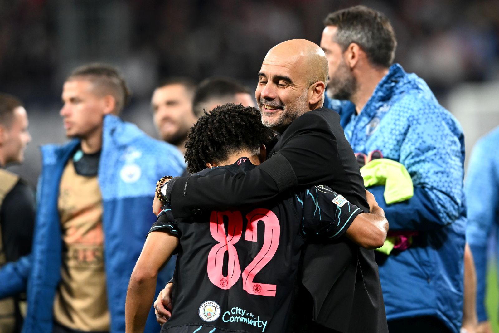 epa10900627 Manchester City's head coach Pep Guardiola (R) celebrates with his player Rico Lewis (L) after winning the UEFA Champions League group G soccer match between RB Leipzig and Manchester City, in Leipzig, Germany, 04 October 2023.  EPA/FILIP SINGER