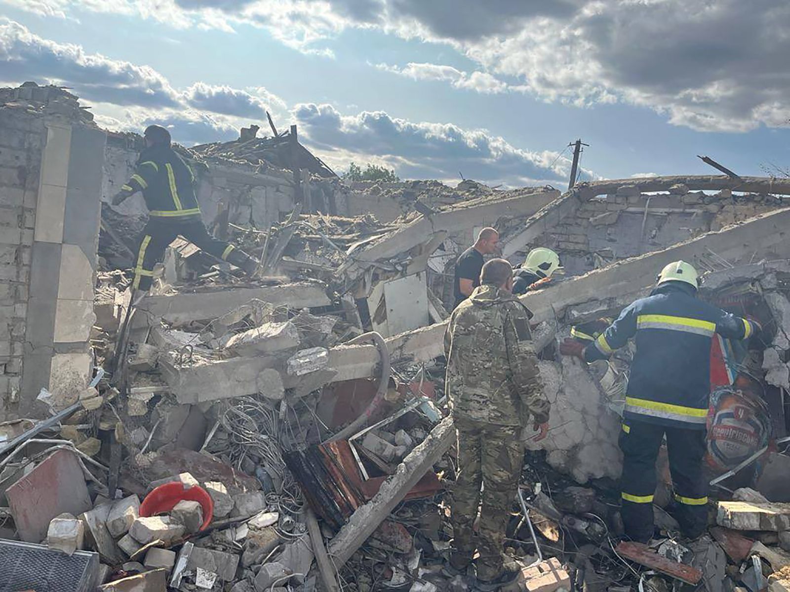 epa10901601 A handout photo made available by the Head of the Office of the President of Ukraine Andriy Yermak via telegram shows rescuers working at the site after shelling hit the village of Hroza, Kupiansk district, Kharkiv region, northeastern Ukraine, 05 October 2023, amid the Russian invasion. At least 48 were killed, including a six-year-old child, and six others were injured, including a young girl, after a Russian missile 'hit a civilian object' in the village of Hroza, Kupiansk district, the head of Ukraine's Presidential Office Andriy Yermak wrote on telegram.  EPA/Head of Ukraine's Presidential Office Andriy Yermak HANDOUT -- BEST QUALITY AVAILABLE -- HANDOUT EDITORIAL USE ONLY/NO SALES