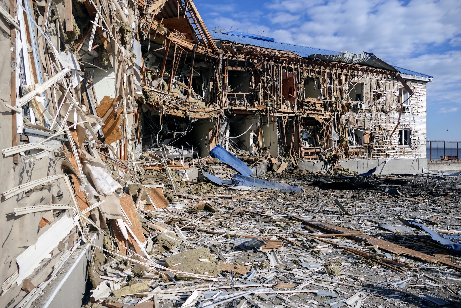 epa10923266 The building of a sailing school, damaged by debris of a downed drone in Odesa, Ukraine, 17 October 2023. Six Shahed attack drones were downed according to the Odesa Obast Military Administration, damaging the sailing school, a hangar and several civilian boats.  EPA/Ihor Tkachenko