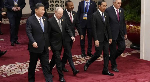epa10924702 (L-R) Chinese President Xi Jinping, Russian President Vladimir Putin, Ethiopian Prime Minister Abiy Ahmed, Indonesian President Joko Widodo and Kazakhstan's President Kassym-Jomart Tokayev head to a group photo session at the Third Belt and Road Forum at the Great Hall of the People in Beijing, China, 18 October 2023.  EPA/Suo Takekuma/POOL