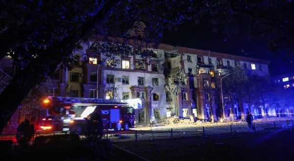 epa10924951 Rescue services attend to the scene of a residential building hit by a missile strike in, Zaporizhia, Ukraine, 18 October 2023. Two people were killed and three injured after Russia attacked Zaporizhzhia with missiles overnight, the Interior Ministry reported.  EPA/Kateryna Klochko