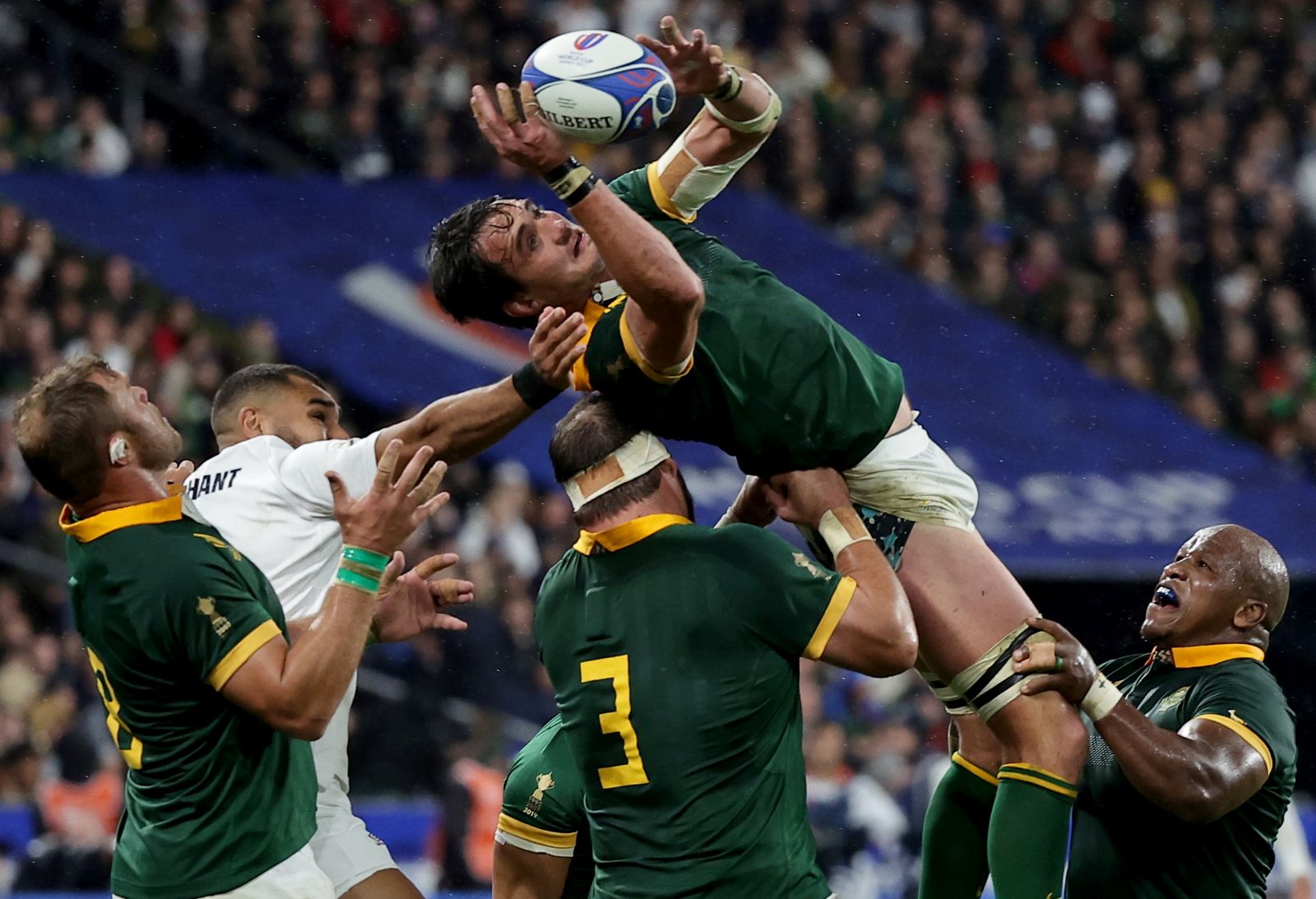epa10931594 South Africa's Franco Mostert (up) in action during the Rugby World Cup 2023 semi final match between England and South Africa in Saint-Denis, France, 21 October 2023.  EPA/CHRISTOPHE PETIT TESSON