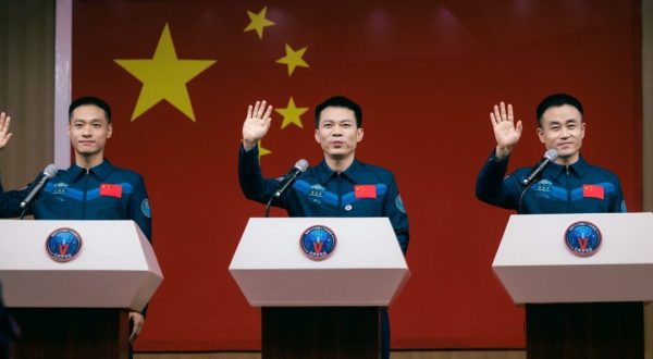 epa10937506 Astronauts of Shenzhou-17 spaceflight mission Tang Hongbo (C), Tang Shengjie (R), and Jiang Xinlin attend a press conference in Jiuquan, Gansu province, China, 25 October 2023. The Shenzhou-17 is the second manned spaceflight mission of the China Space Station's development phase, expected to last for about six months, with the crew carrying out installation, maintenance, repair and experimental tasks in space.  EPA/ALEX PLAVEVSKI