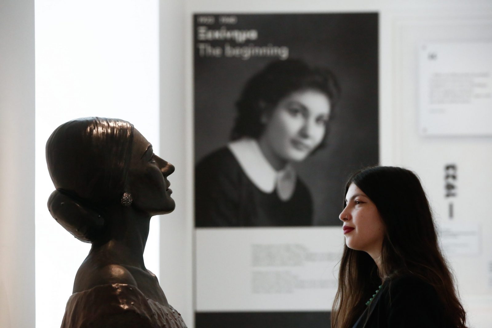 epa10938133 A woman poses for a picture as she looks at a portrait bust of the late soprano Maria Callas during a press view of the new Maria Callas museum in Athens, Greece, 25 October 2023. Callas was an American-born Greek soprano and one of the most famous opera singers of the 20th century.  EPA/YANNIS KOLESIDIS