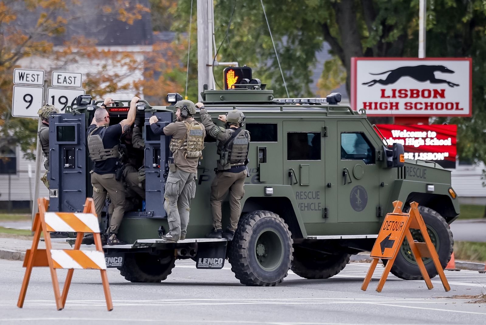 epa10941256 A police tactical unit makes its way down a street during the search for mass-shooting suspect Robert Card in Lisbon Falls, Maine, USA, 26 October 2023. Police are searching for suspect Robert Card following a mass shooting which killed 18 and injured 13 in nearby Lewiston, Maine, 25 October 2023.  EPA/CJ GUNTHER