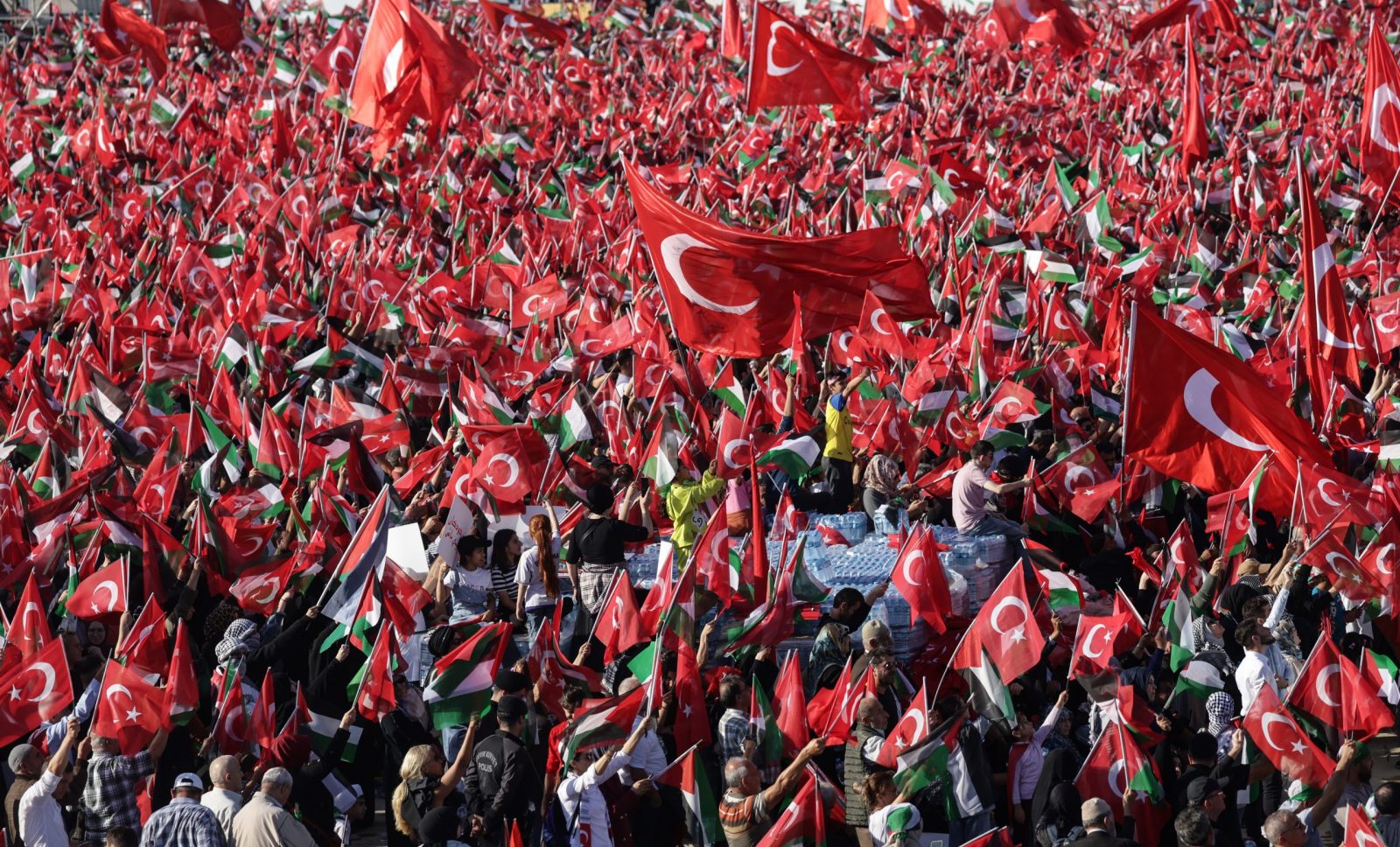epa10945556 Supporters of Turkish President Recep Tayyip Erdogan hold Turkish and Palestinian flags during a pro-Palestinian rally at the Ataturk Airport in Istanbul, Turkey, 28 October 2023. Thousands of Israelis and Palestinians have died since the militant group Hamas launched an unprecedented attack on Israel from the Gaza Strip on 07 October, and the Israeli strikes on the Palestinian enclave which followed it.  EPA/ERDEM SAHIN