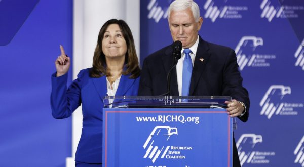 epa10945780 Republican candidate for President, former Vice President Mike Pence (R) stands next to Former Second Lady of the United States and wife Karen Pence (L) as he announces the end of his bid for US president during the 2023 Republican Jewish Coalition Annual Leadership Meeting at the Venetian hotel and casino in Las Vegas, Nevada, USA, 28 October 2023.  EPA/CAROLINE BREHMAN
