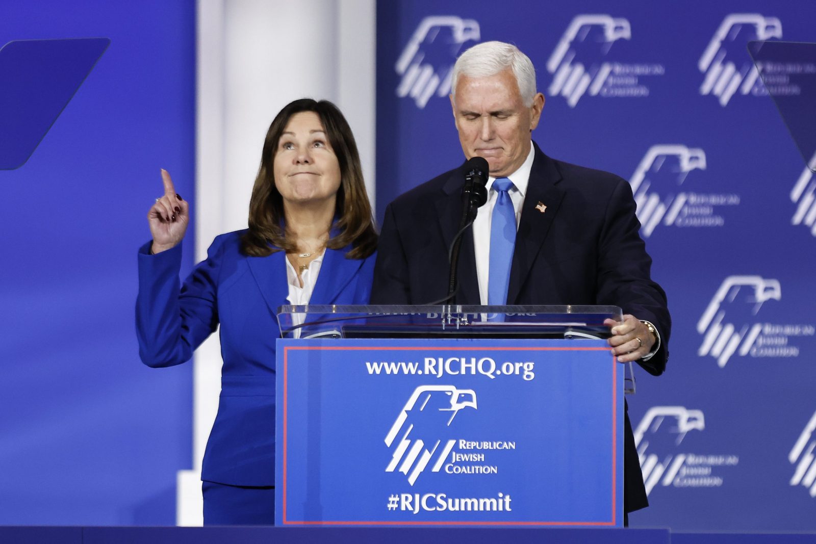 epa10945780 Republican candidate for President, former Vice President Mike Pence (R) stands next to Former Second Lady of the United States and wife Karen Pence (L) as he announces the end of his bid for US president during the 2023 Republican Jewish Coalition Annual Leadership Meeting at the Venetian hotel and casino in Las Vegas, Nevada, USA, 28 October 2023.  EPA/CAROLINE BREHMAN