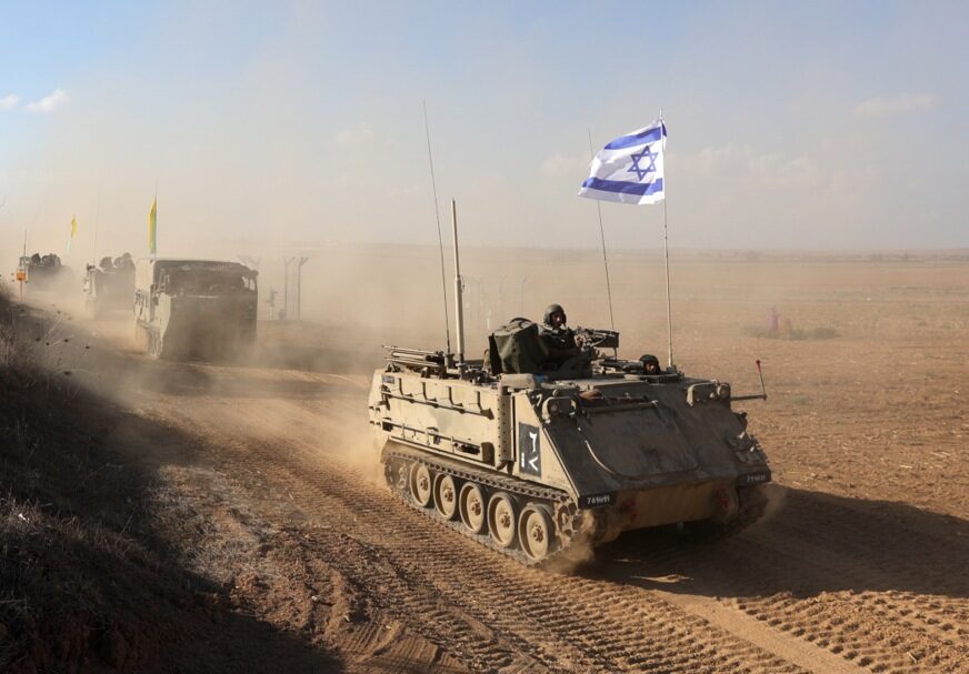 epa10920321 Israeli armoured personnel carriers (APCs) maneuver at an area along the border with Gaza, southern Israel, 15 October 2023. The Israel Defense Force (IDF) on 14 October announced they are increasing readiness and preparing to 'implement a wide range of operational offensive plans', including combined and coordinated strikes by land, sea and air. Israel has called for the evacuation of all civilians of northern Gaza ahead of an expected ground invasion. More than 1,300 Israelis have been killed and over 3,200 others injured, according to the IDF, after the Islamist movement Hamas launched an attack against Israel from the Gaza Strip on 07 October. More than 2,300 Palestinians have been killed and over 9,000 others injured in Gaza since Israel launched retaliatory air strikes, the Palestinian health ministry said.  EPA-EFE/ABIR SULTAN