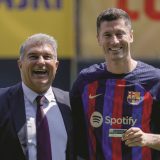 Polish forward Robert Lewandowski, right, and FC Barcelona president Joan Laporta react, during the official presentation after signing for FC Barcelona, in Barcelona, Spain, Friday, Aug. 5, 2022. (AP Photo/Joan Monfort)