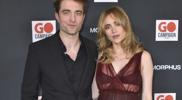 Robert Pattinson, left, and Suki Waterhouse arrive at the GO Campaign's annual GO Gala on Saturday, Oct. 21, 2023, in Los Angeles. (Photo by Jordan Strauss/Invision/AP)