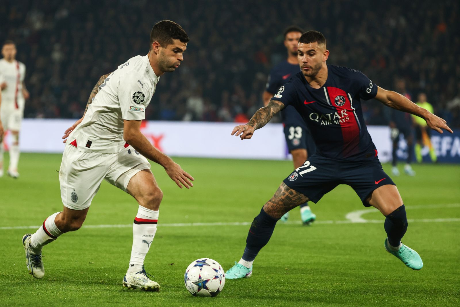 epa10939090 AC Milan's Christian Pulisic (L) in action against Paris Saint Germain's Lucas Hernandez (R) during the UEFA Champions League Group F match between Paris Saint-Germain and AC Milan in Paris, France 25 October 2023.  EPA/MOHAMMED BADRA