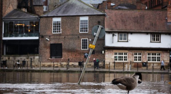epa10949163 A submerged street sign stands in flood water in York, Britain, 30 October 2023. Severe flood warnings are in place in parts of North Yorkshire following weeks of heavy rain brought by storms Agnes and Babet. The Meteorological Office is forecasting strong winds and heavy rain across southern England as Storm Ciaran is expected to arrive on 01 November.  EPA/ADAM VAUGHAN