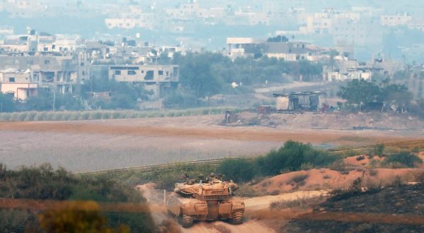 epa10952028 An Israeli tank maneuvers next to the Gaza Strip, as seen from Sderot, southern Israel, 01 November 2023. Overnight, combined IDF troops struck several targets throughout the Gaza Strip as part of its 'ground operations' in the Gaza Strip, the Israel Defense Forces (IDF) said on 01 November, adding that since 07 October the IDF struck over 11,000 targets in the Palestinian enclave. More than 8,000 Palestinians and at least 1,400 Israelis have been killed, according to the IDF and the Palestinian health authority, since Hamas militants launched an attack against Israel from the Gaza Strip on 07 October, and the Israeli operations in Gaza and the West Bank which followed it.  EPA/ATEF SAFADI